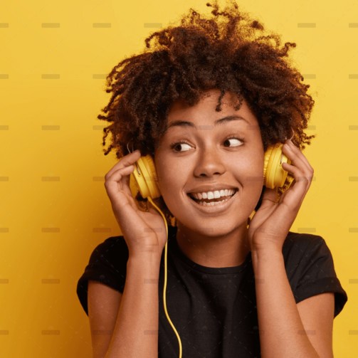 demo-attachment-36-happy-dark-skinned-woman-wears-wired-headphones-enjoys-nice-music-looks-away-has-toothy-smile